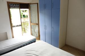 A bed or beds in a room at Appartamento Sabrina