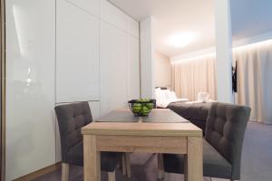Postel nebo postele na pokoji v ubytování Apart-Hotel VIVI RESIDENCE & SPA