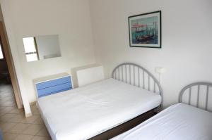 A bed or beds in a room at Appartamento Sabrina