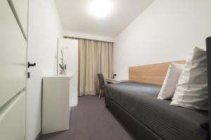 Postel nebo postele na pokoji v ubytování Apart-Hotel VIVI RESIDENCE & SPA