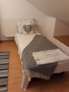 Postel nebo postele na pokoji v ubytování Vila Calix