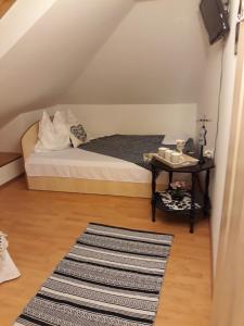 Postel nebo postele na pokoji v ubytování Vila Calix