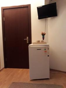 TV a/nebo společenská místnost v ubytování Vila Calix