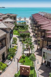 a view of the beach from the balcony of a resort at Braira Al Azizya Hotel & Resort in Al Khobar