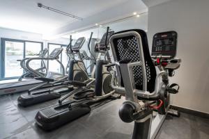a gym with several cardio machines in a room at Rosamar Es Blau 4*s - Adults Only in Lloret de Mar +63 photos