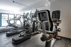 a gym with several cardio machines in a room at Rosamar Es Blau 4*s - Adults Only in Lloret de Mar