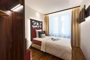 Voodi või voodid majutusasutuse Hotel Scheuble toas