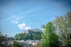 a view of a castle on top of a hill at APT. STONE-LODGE in Salzburg