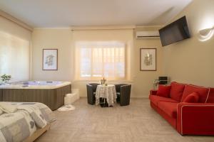 Posezení v ubytování Villa Domus Salento Suites & Rooms con parcheggio privato in loco