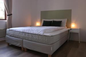 Un pat sau paturi într-o cameră la Valldal Gjestgiveri