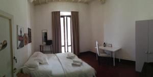 A bed or beds in a room at Casa di Alfredo Affittacamere