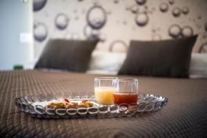 a plate of food and a drink on a table at B&B In Centro Palermo in Palermo