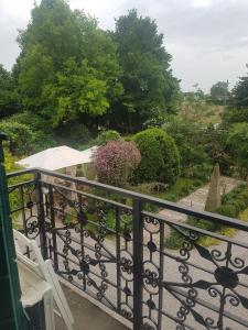a view of a garden from a balcony at Villa Leonati in Padova