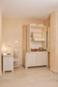 Kuchyň nebo kuchyňský kout v ubytování L' Araba Fenice Hotel & Resort
