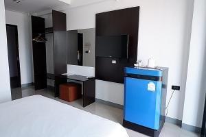 Postel nebo postele na pokoji v ubytování Izen Budget Hotel & Residence