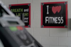 a wall with signs that say i heart and fitness at Magic Moment Resort and Kids Club in Kissimmee