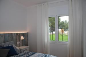 Postel nebo postele na pokoji v ubytování New Madrague Sun