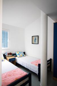 Postel nebo postele na pokoji v ubytování Apartmani Rakic