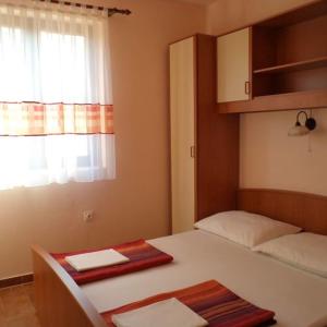 Ένα ή περισσότερα κρεβάτια σε δωμάτιο στο villa Adriana apartments