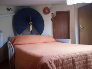 Кровать или кровати в номере La mansarda di Daniela