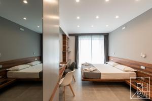 A bed or beds in a room at B&B Rakel Home
