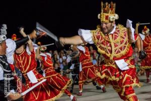 a group of men in traditional dances in front of a crowd at Mario (RADE) in Korčula