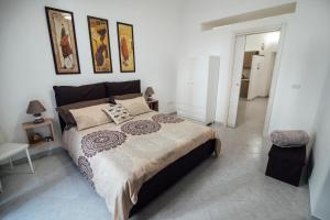 A bed or beds in a room at Via Vittorio Emanuele Apartment Még 31 kép
