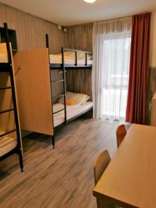 Voodi või voodid majutusasutuse Alpenstern Hotel toas