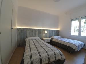 Llit o llits en una habitació de New Madrague Beach