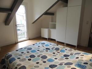 a bedroom with a large bed in a room at L'enclos Sainte-Enimie Gorges du Tarn et Causses in Sainte-Énimie