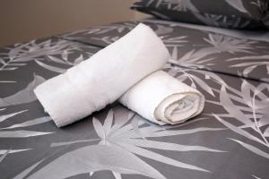a roll of toilet paper sitting on a bed at Apartment Noah in Zadar