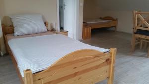 Katil atau katil-katil dalam bilik di Gästezimmer Langenselbold