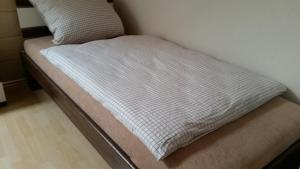 Postel nebo postele na pokoji v ubytování Gästezimmer Langenselbold + 3 fotografie