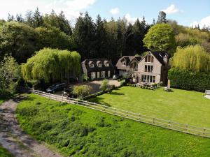 an aerial view of a house with a fence at The Apartments @ Quidhampton Mill in Salisbury