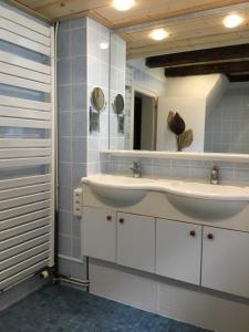 a bathroom with two sinks and a mirror at notre maison à Eguisheim in Eguisheim +27 photos