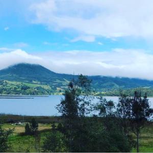 a large body of water with a mountain in the background at Chalet la Bonita in El Encano +20 photos