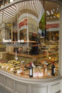 a display window of a bakery with a bunch of pastries at Vieille Ville 1 - Luca's Apartment, 1 bedroom, max 2 adults and 2 kids in Antibes +67 photos