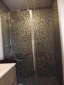 a bathroom with a shower with a glass door at Au Bonheur Frontalier in Steenvoorde +29 photos