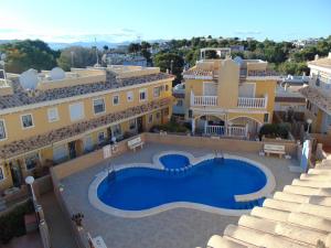 an aerial view of a villa with a swimming pool at 2 Bedroom Algorfa Townhouse with Pool in Castillo de Montemar