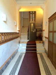 a hallway with stairs and a door in a building at Echi del Mare in La Spezia