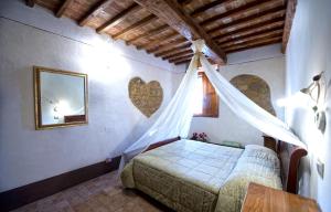 Posteľ alebo postele v izbe v ubytovaní Agriturismo Palazzo Conti A