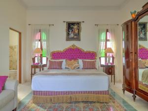 
A bed or beds in a room at El Palacito Secreto Luxury Boutique Hotel & Spa
