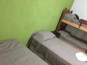 Cama ou camas em um quarto em Chilo Hotel
