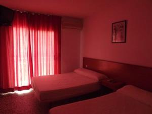 Postel nebo postele na pokoji v ubytování Hotel Iris