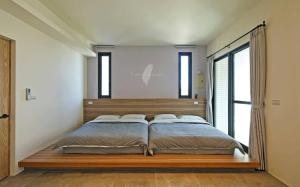 Ein Bett oder Betten in einem Zimmer der Unterkunft Less is more
