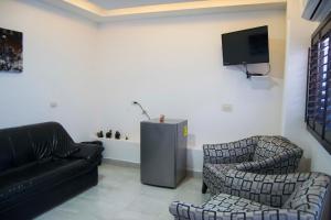 TV i/ili multimedijalni sistem u objektu Hotel Onix Suites