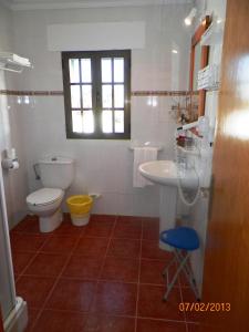 a bathroom with a toilet and a sink at Casa Francisco el de Siempre in El Palmar