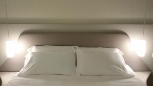 Posteľ alebo postele v izbe v ubytovaní Hotel Borgovico