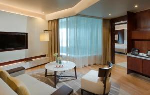Uma televisão e/ou sistema de entretenimento em Melia Yangon