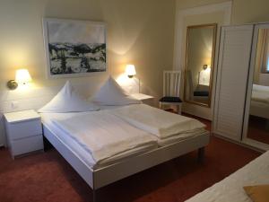 מיטה או מיטות בחדר ב-Gästehaus Schmitz
